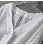 V-ringad texturerad blus med knappar för dam-Blouses for women-Fjallbarn